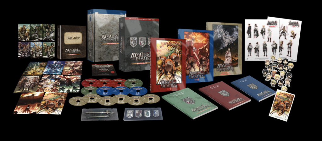 Contenido de la edición Deluxe de Ataque a los Titanes de Selecta Visión, con discos Blu-ray, libros, tarjetas, pegatinas y artículos coleccionables.
